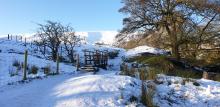 Snowboots and Shades up Pendle Hill.  © Carolyn Raw 